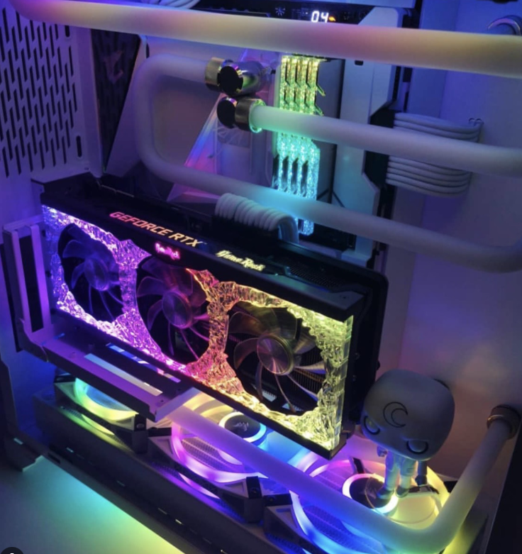 A closeup photograph of a gaming PC lit up with RGB